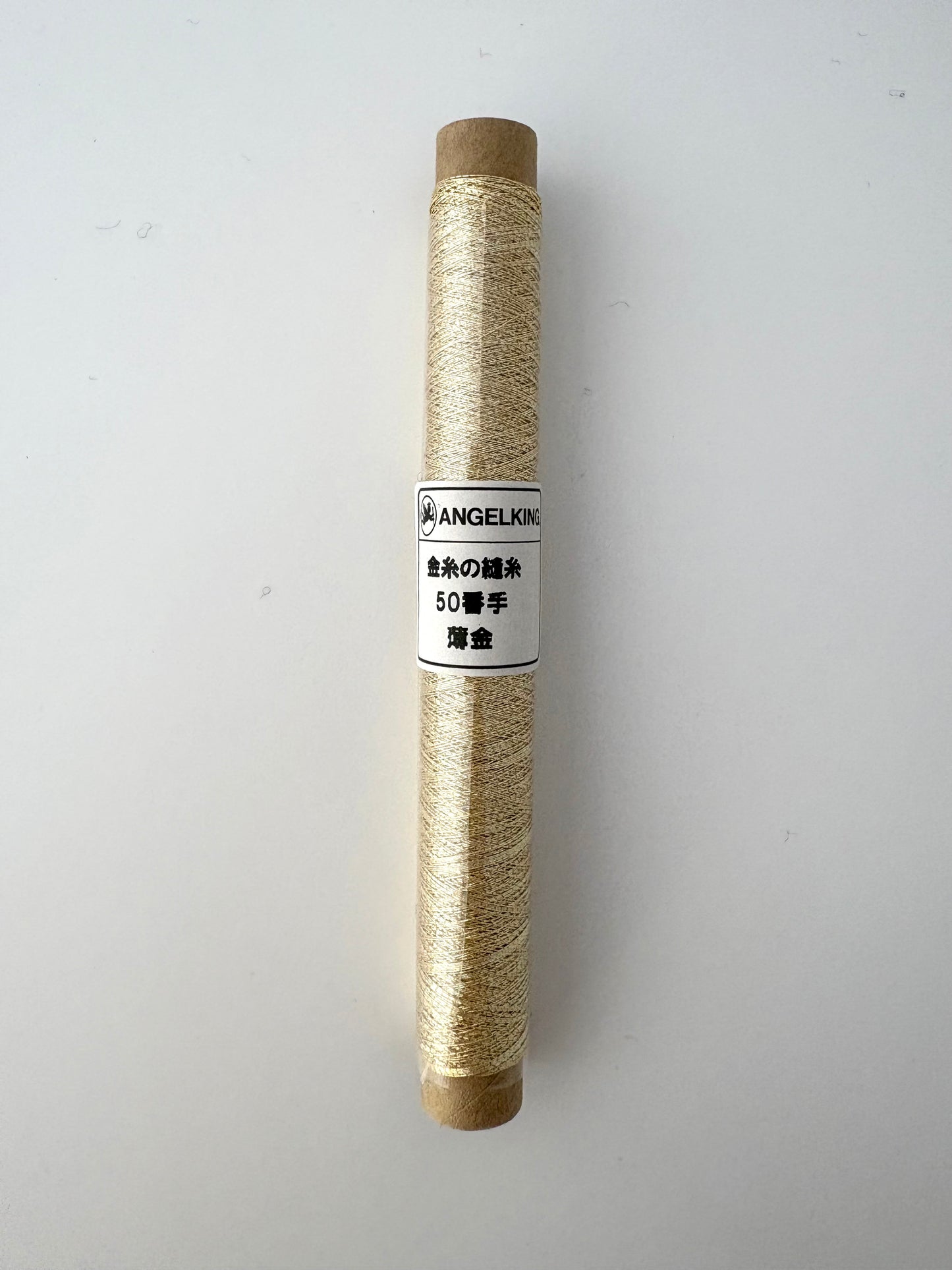 50wt gold metallic thread, cigarette spool, 50m